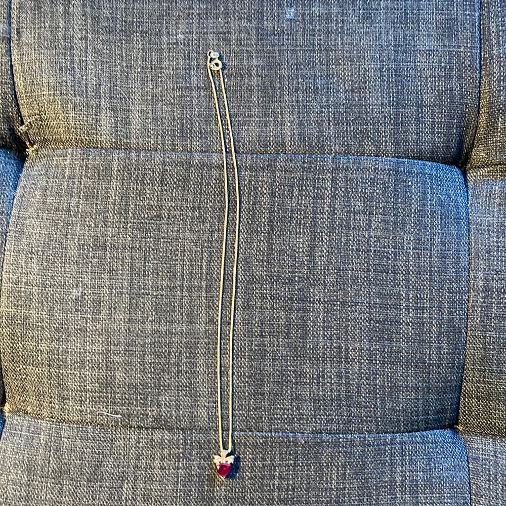 Ruby heart set in gold